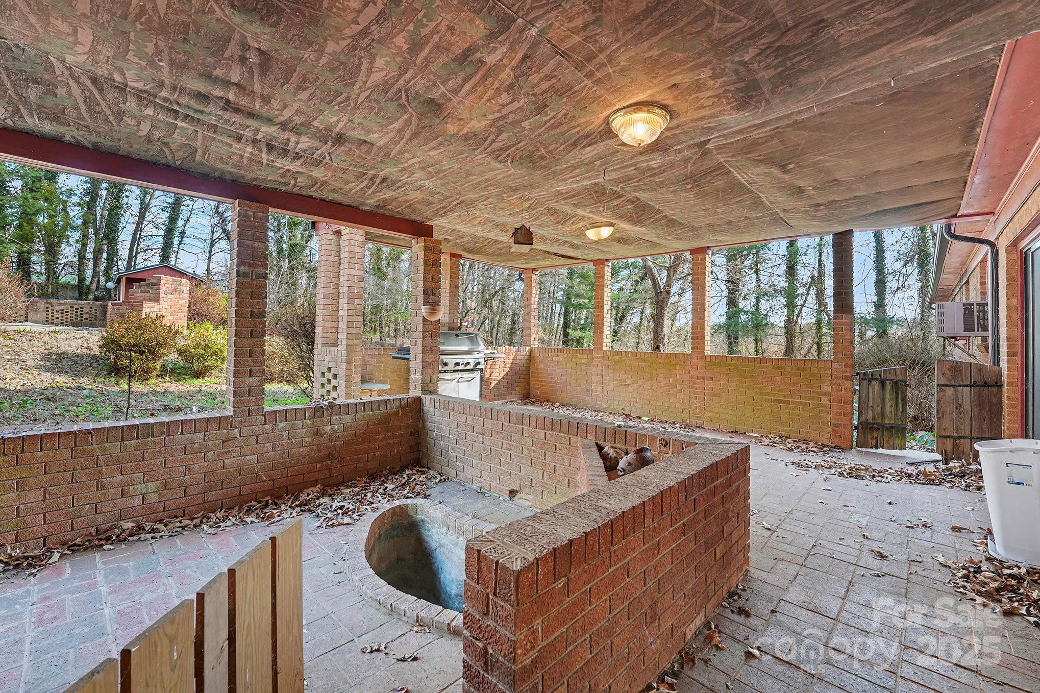 3442 Lester Street Conover, NC 28613 - Photo 32 of 38 a living room with furniture and a floor to ceiling window