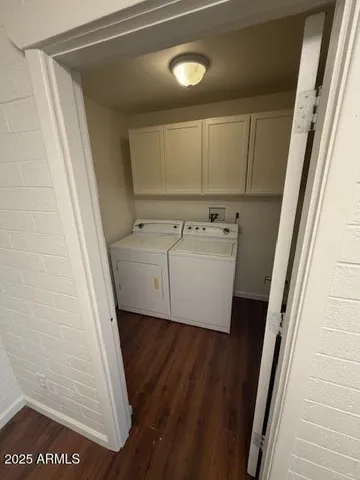 a view of a hallway with washer and dryer
