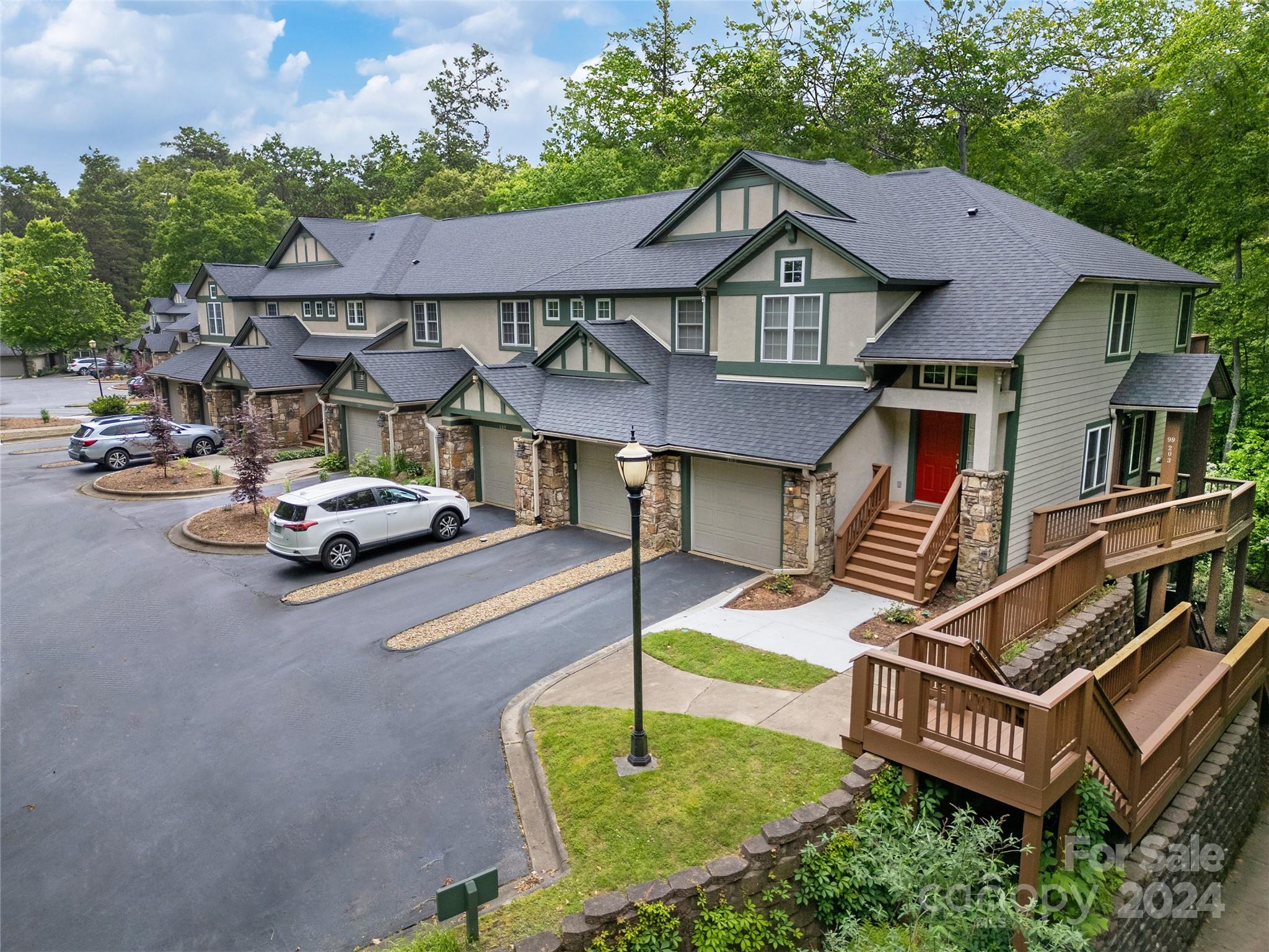 99 Ridgetop Circle, Unit 102 Brevard, NC 28712 - Photo 2 of 36 a front view of a house with garden