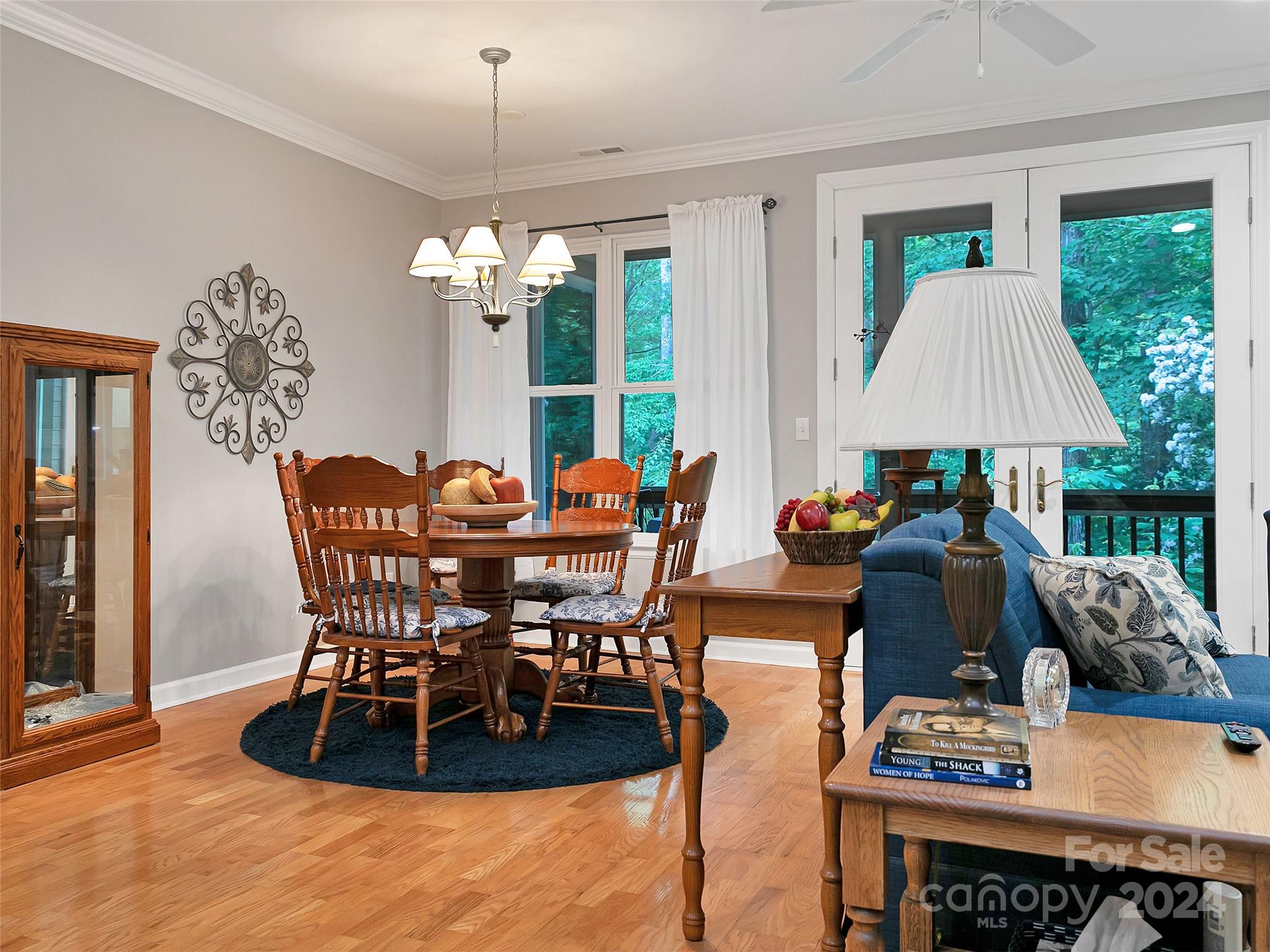 99 Ridgetop Circle, Unit 102 Brevard, NC 28712 - Photo 22 of 36 a view of a dining room with furniture window and outside view