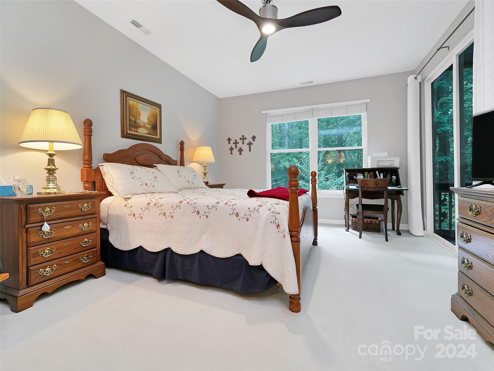 99 Ridgetop Circle, Unit 102 Brevard, NC 28712 - Photo 32 of 36 a bed room with a bed and a chair