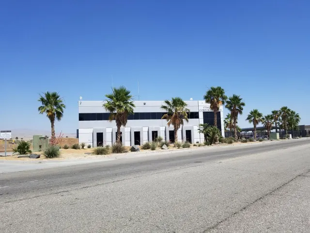 a view of a street with a cars parked