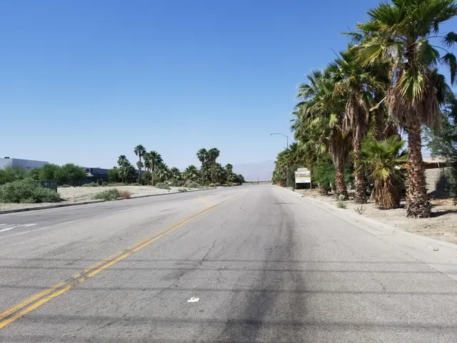 a view of a trees and barn in the background