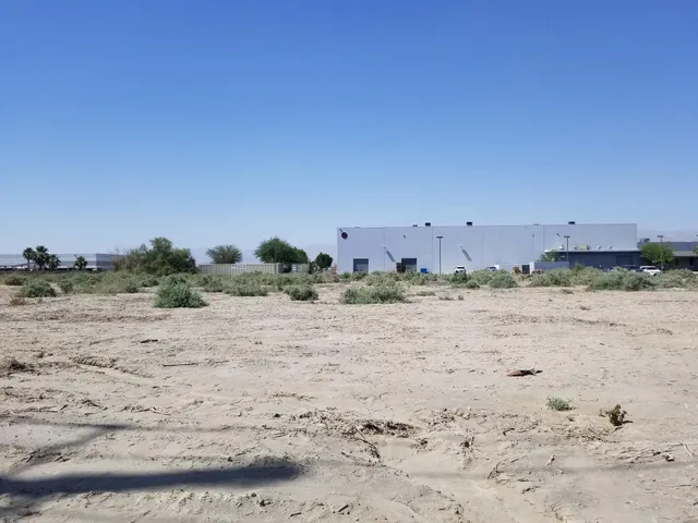 a view of a street with tall building