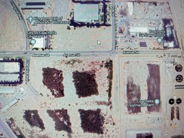 a view of a house with a yard and tree s