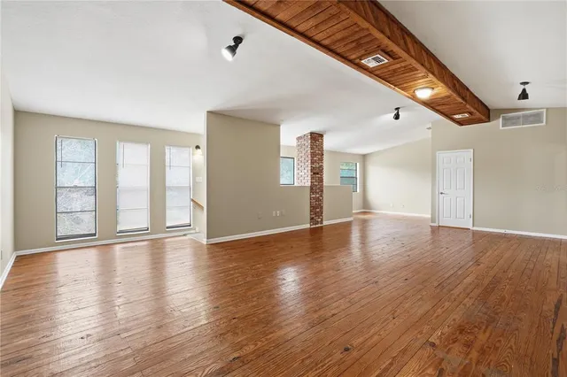 a kitchen with stainless steel appliances granite countertop a sink and a stove