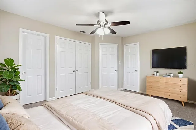 an empty room with white walls and tiles