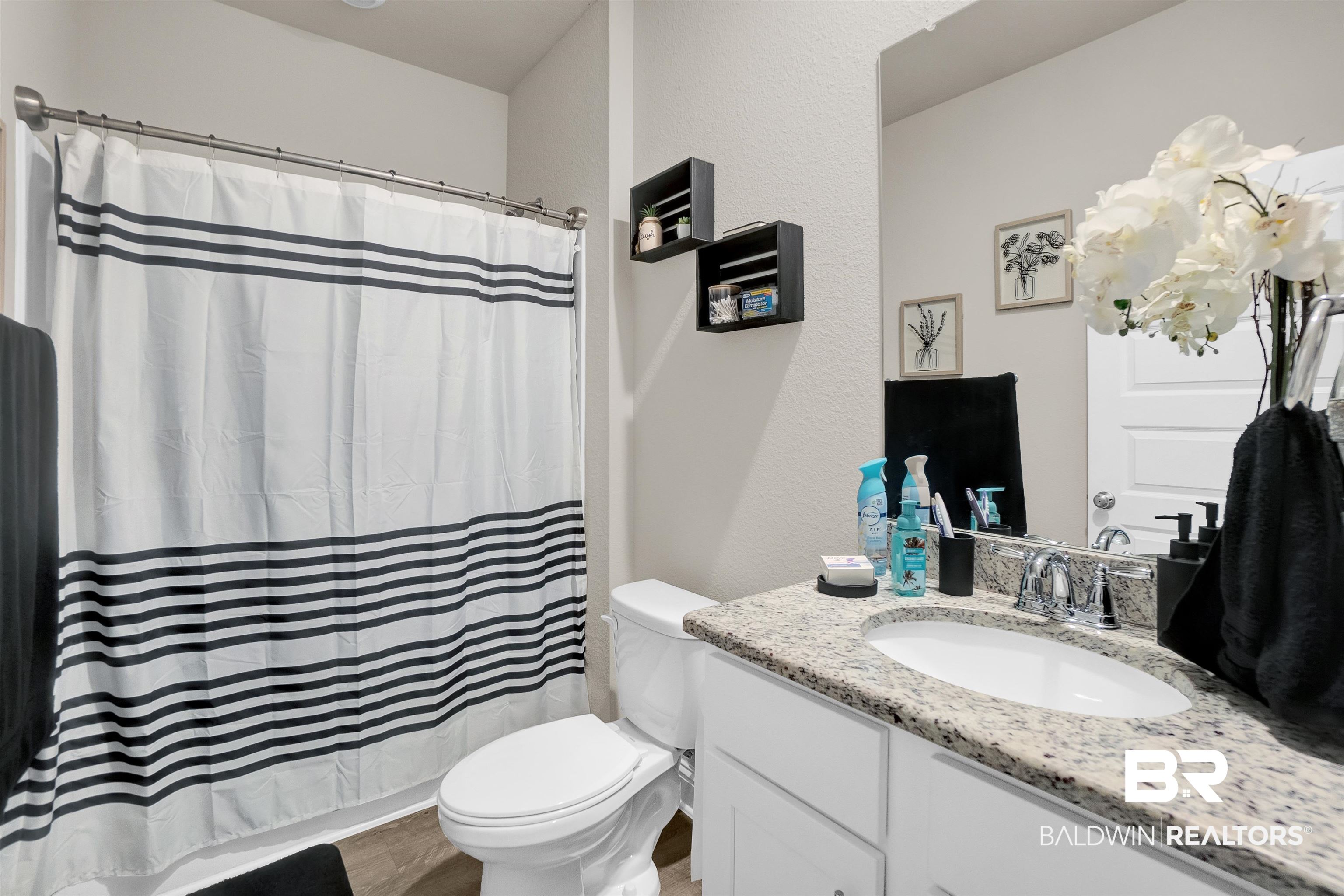 31671 Memphis Loop Daphne, AL 36527 - Photo 10 of 51 Full bathroom with toilet, vanity, a shower with shower curtain, and wood finished floors