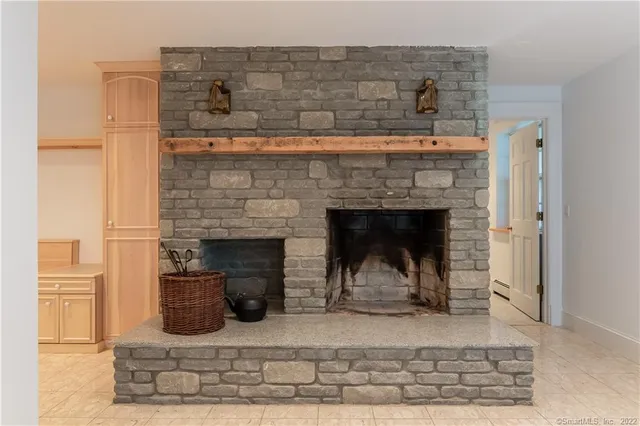 a view of living room filled with furniture and tv