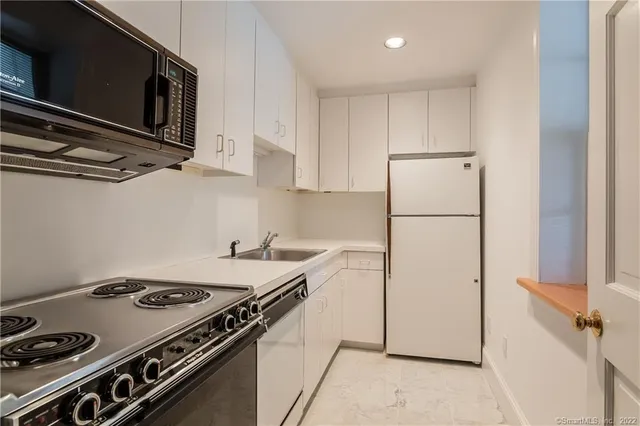 a room with pool table and furniture
