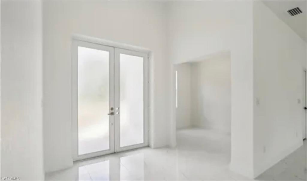 2512 9th Street Southwest Lehigh Acres, FL 33976 - Photo 4 of 10 a view of an empty room