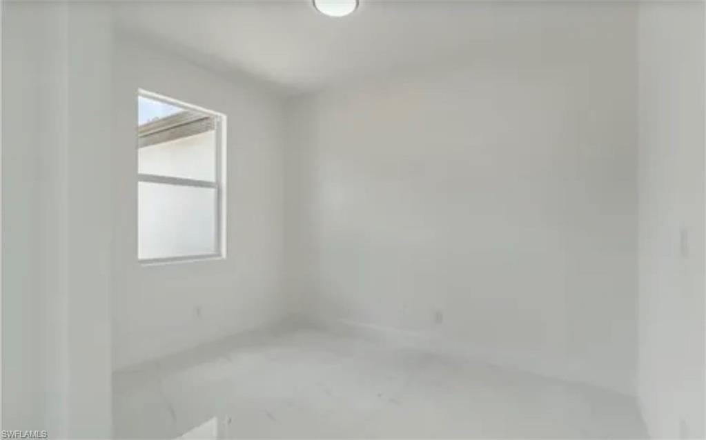 2512 9th Street Southwest Lehigh Acres, FL 33976 - Photo 5 of 10 a small space with a window