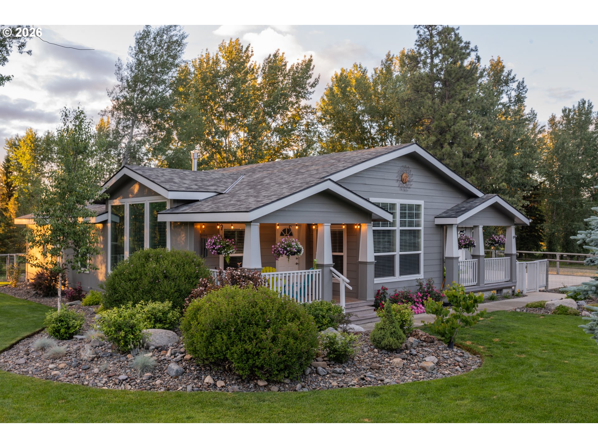 83440 Russell Lane Joseph, OR 97846 - Photo 1 of 19 a front view of a house with a yard and trees