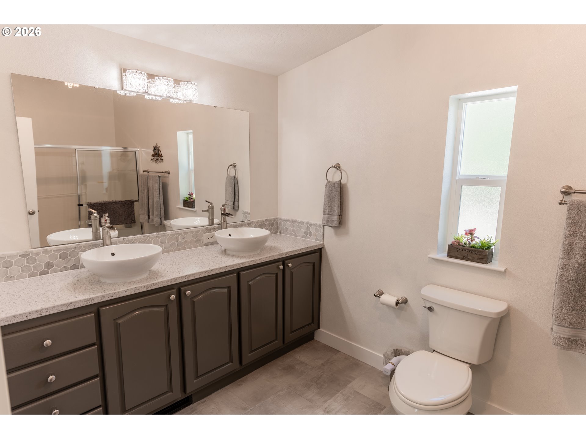 83440 Russell Lane Joseph, OR 97846 - Photo 12 of 19 a bathroom with a granite countertop sink and a mirror
