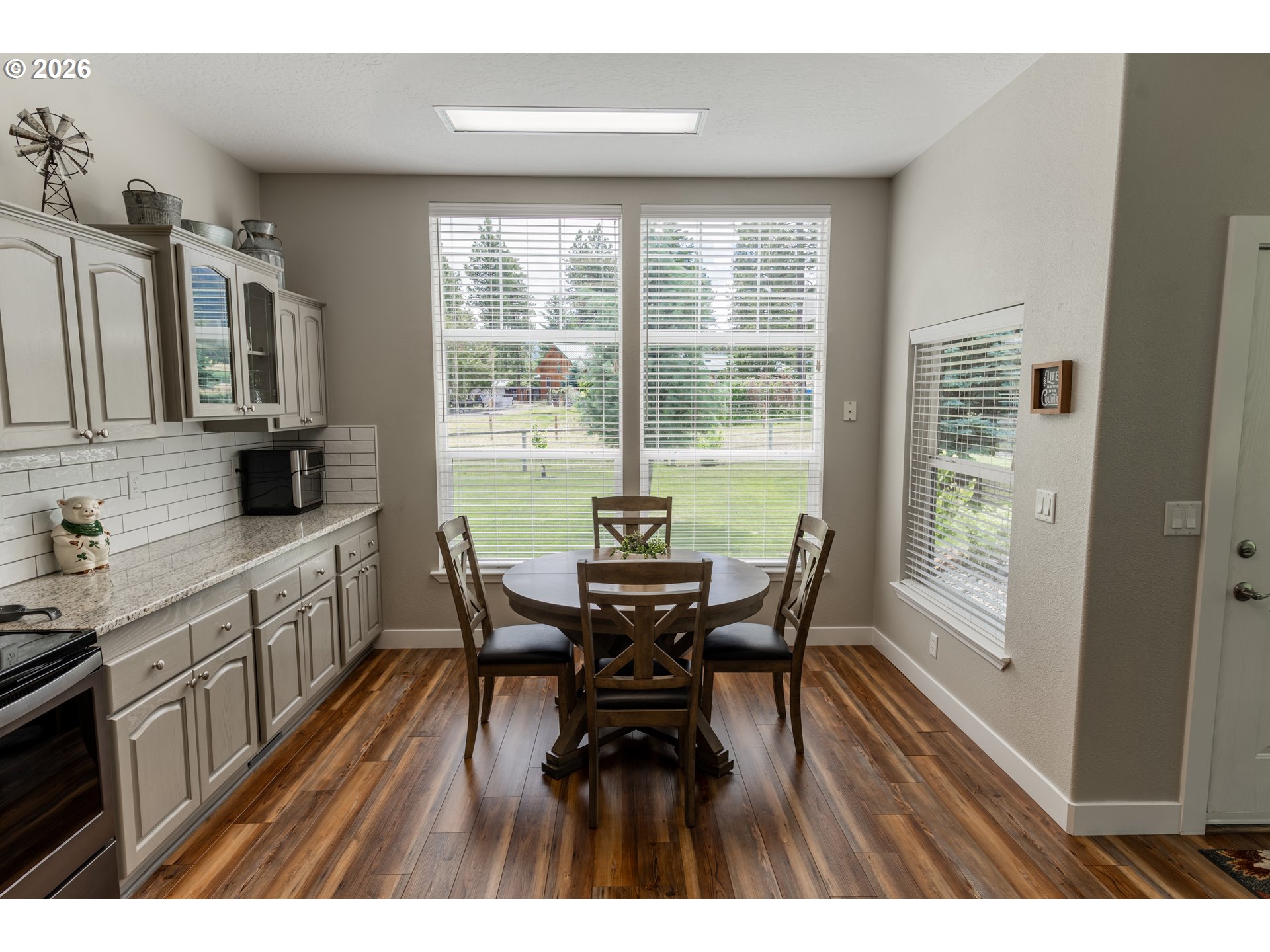 83440 Russell Lane Joseph, OR 97846 - Photo 6 of 19 a view of a dining room with furniture window and wooden floor