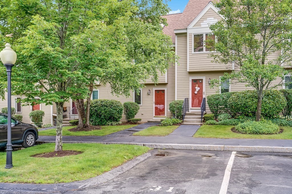 31 Hunters Run Place, Unit 31 Haverhill, MA 01832 - Photo 1 of 32 a front view of house with yard and green space