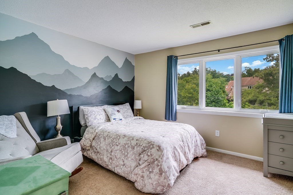 31 Hunters Run Place, Unit 31 Haverhill, MA 01832 - Photo 13 of 32 a bedroom with a bed and large window