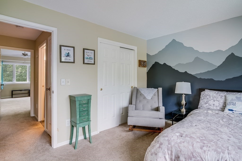31 Hunters Run Place, Unit 31 Haverhill, MA 01832 - Photo 14 of 32 a bedroom with a bed and a couch