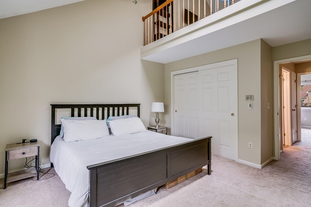 31 Hunters Run Place, Unit 31 Haverhill, MA 01832 - Photo 17 of 32 a bedroom with a bed and a night stand