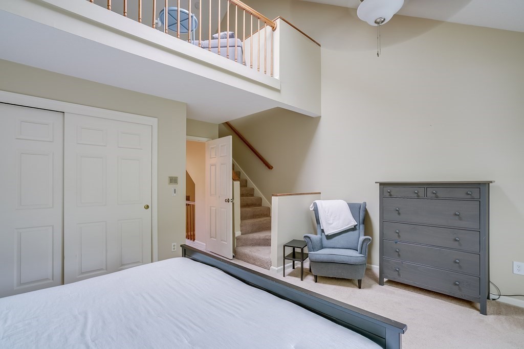 31 Hunters Run Place, Unit 31 Haverhill, MA 01832 - Photo 18 of 32 a bedroom with a bed and a couch