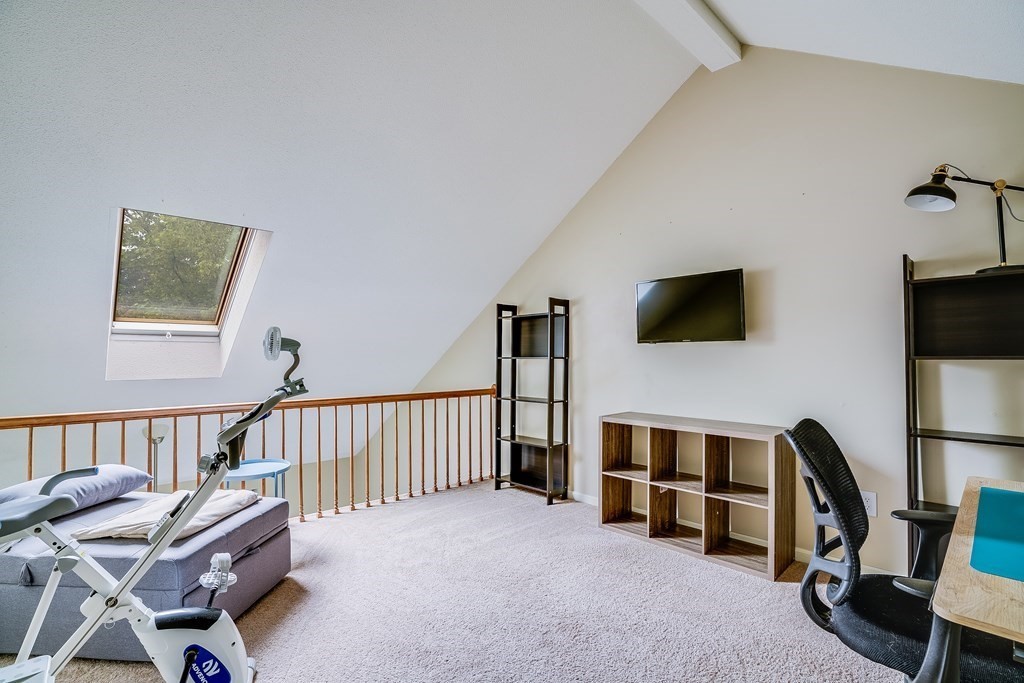 31 Hunters Run Place, Unit 31 Haverhill, MA 01832 - Photo 20 of 32 a living room with furniture and a flat screen tv