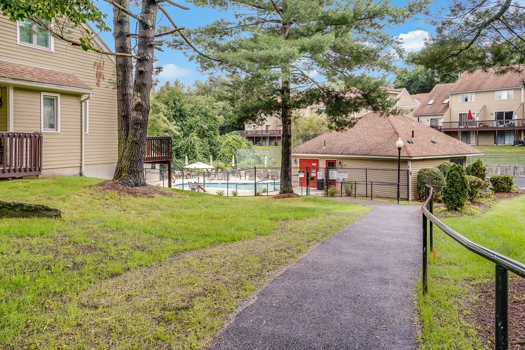 31 Hunters Run Place, Unit 31 Haverhill, MA 01832 - Photo 29 of 32 a view of a house with backyard and a tree