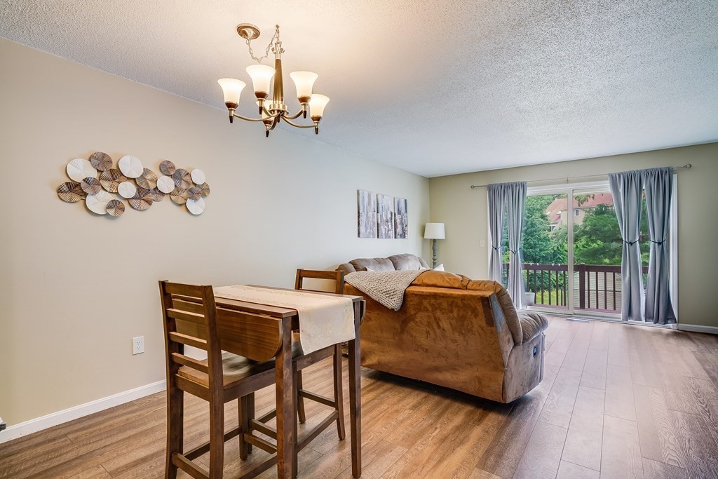 31 Hunters Run Place, Unit 31 Haverhill, MA 01832 - Photo 9 of 32 a living room with furniture and a window