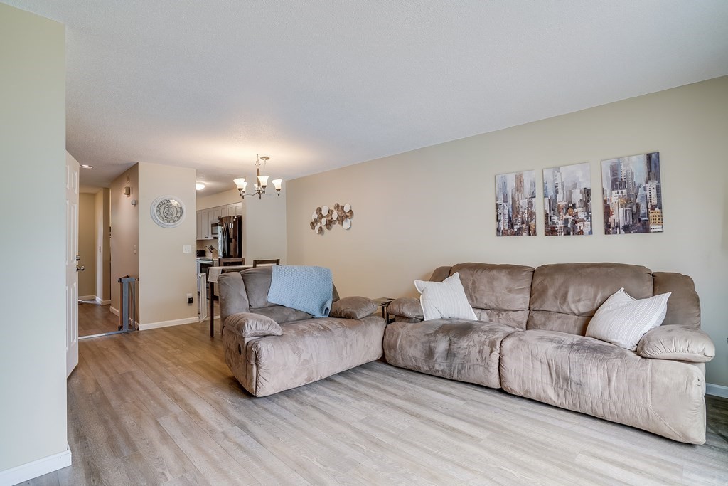 31 Hunters Run Place, Unit 31 Haverhill, MA 01832 - Photo 10 of 32 a living room with furniture and a couch