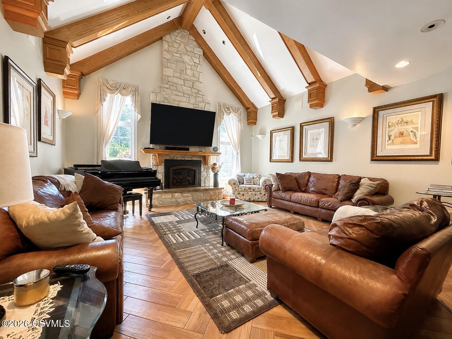 50 Sweet Gum Road Selinsgrove, PA 17870 - Photo 36 of 82 a living room with furniture a flat screen tv and a fireplace
