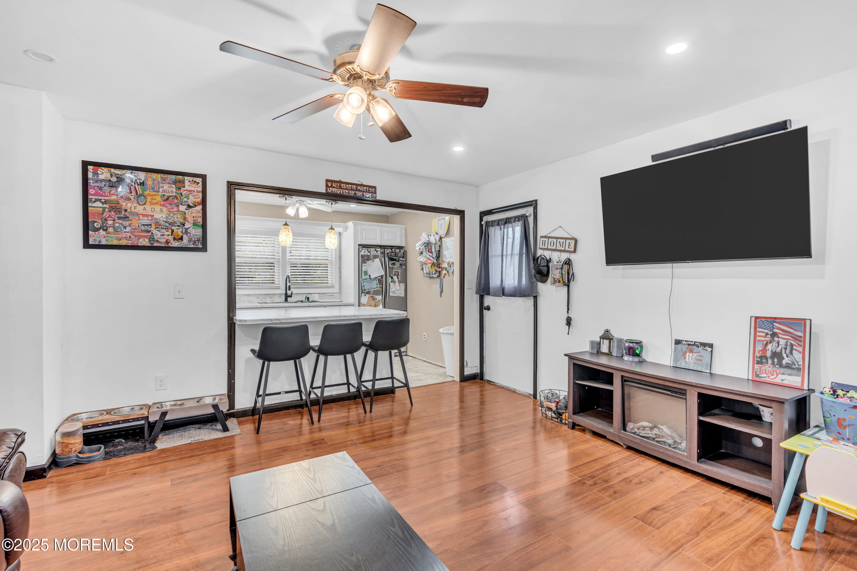 111 3rd Street Barnegat, NJ 08005 - Photo 12 of 22 a living room with furniture and a flat screen tv