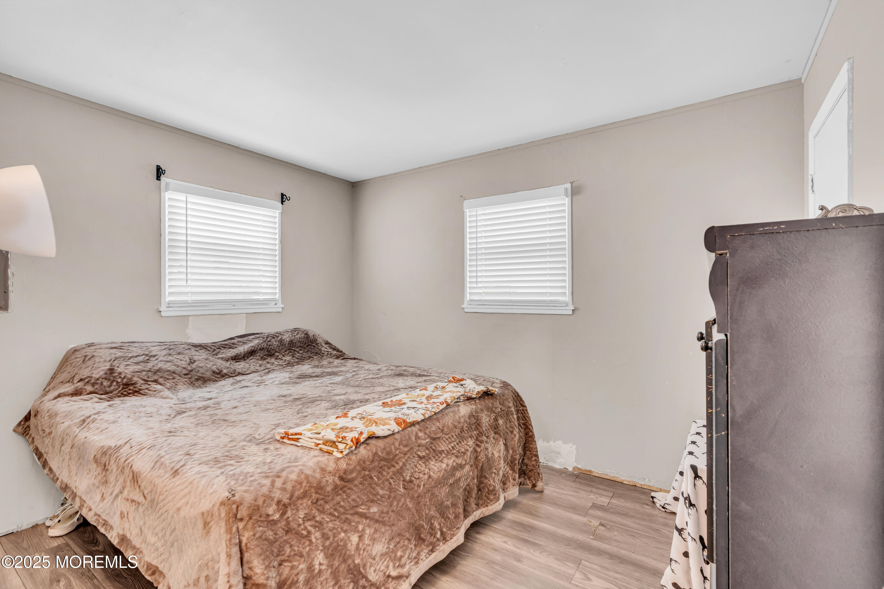 111 3rd Street Barnegat, NJ 08005 - Photo 16 of 22 a bedroom with a bed and a window