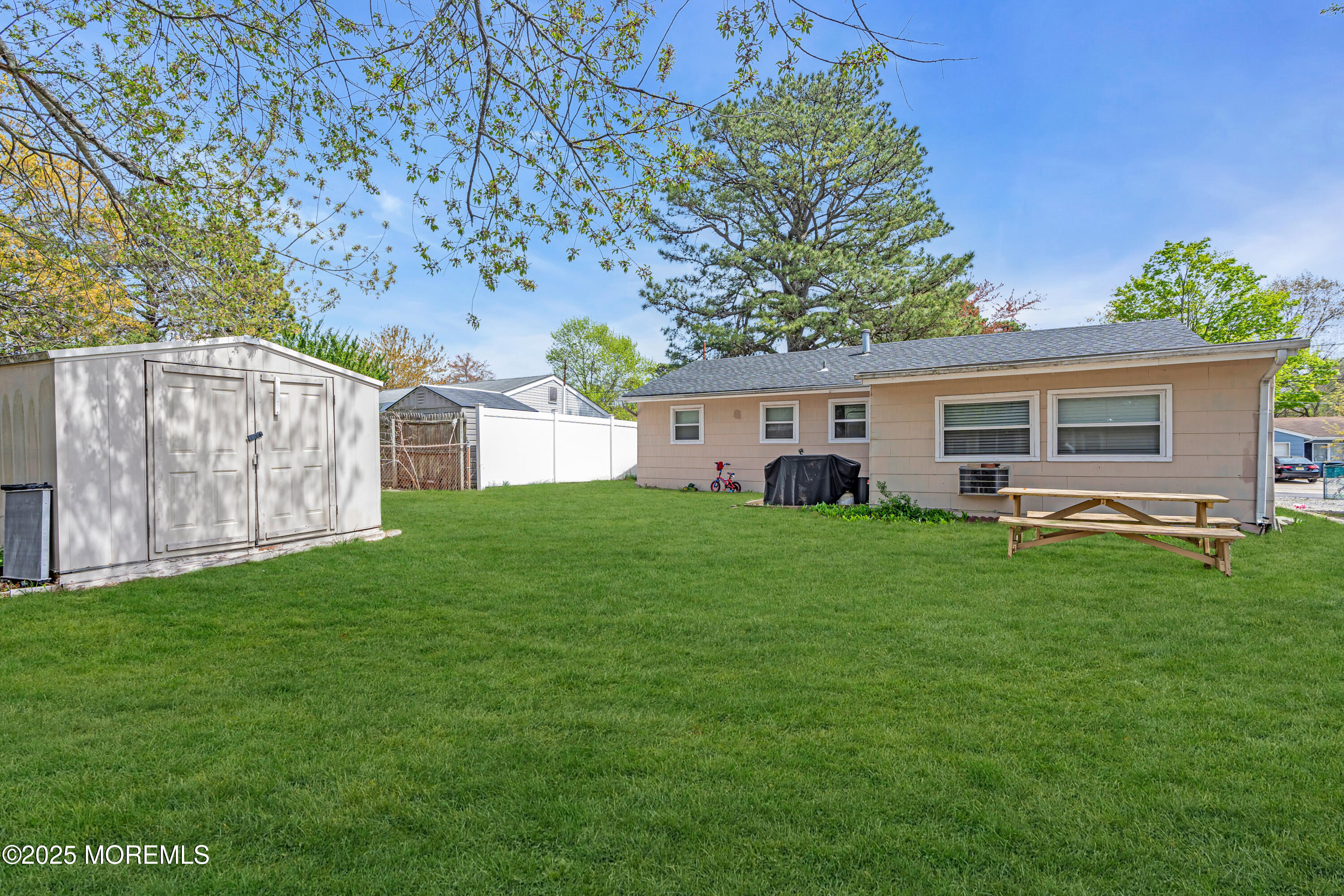 111 3rd Street Barnegat, NJ 08005 - Photo 19 of 22 a front view of house with yard and green space