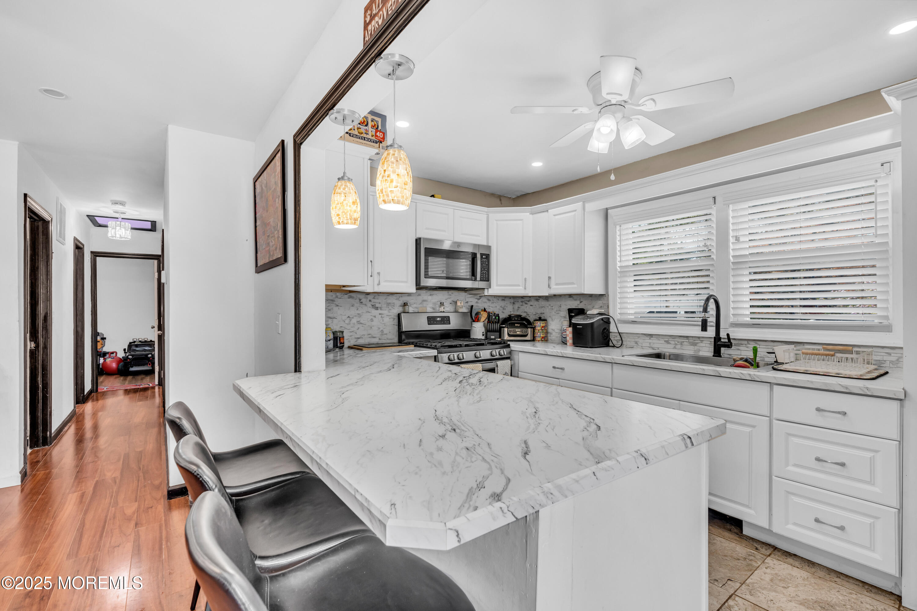 111 3rd Street Barnegat, NJ 08005 - Photo 2 of 22 a large kitchen with sink cabinets and appliances