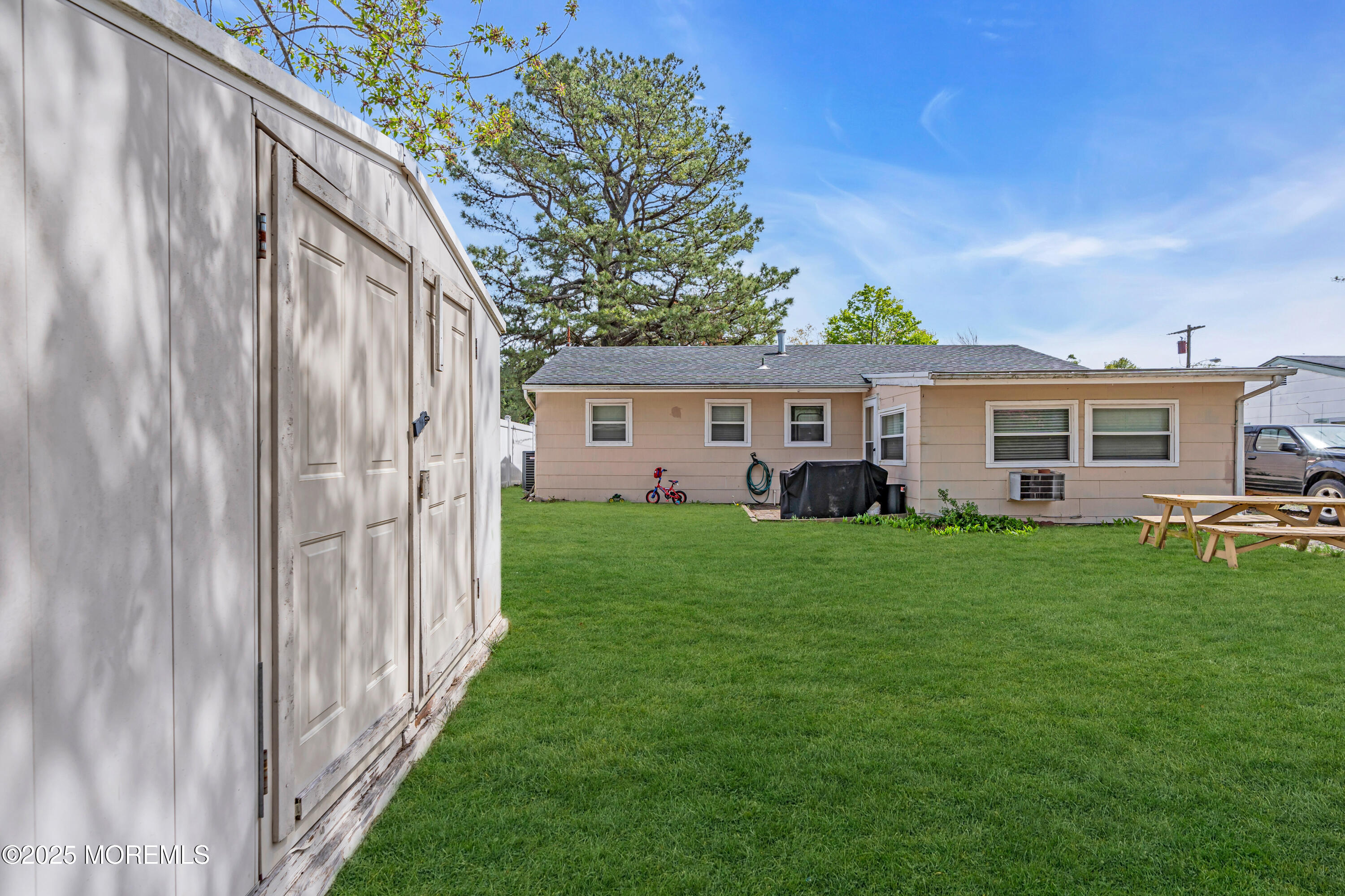 111 3rd Street Barnegat, NJ 08005 - Photo 21 of 22 a front view of a house with a yard and porch