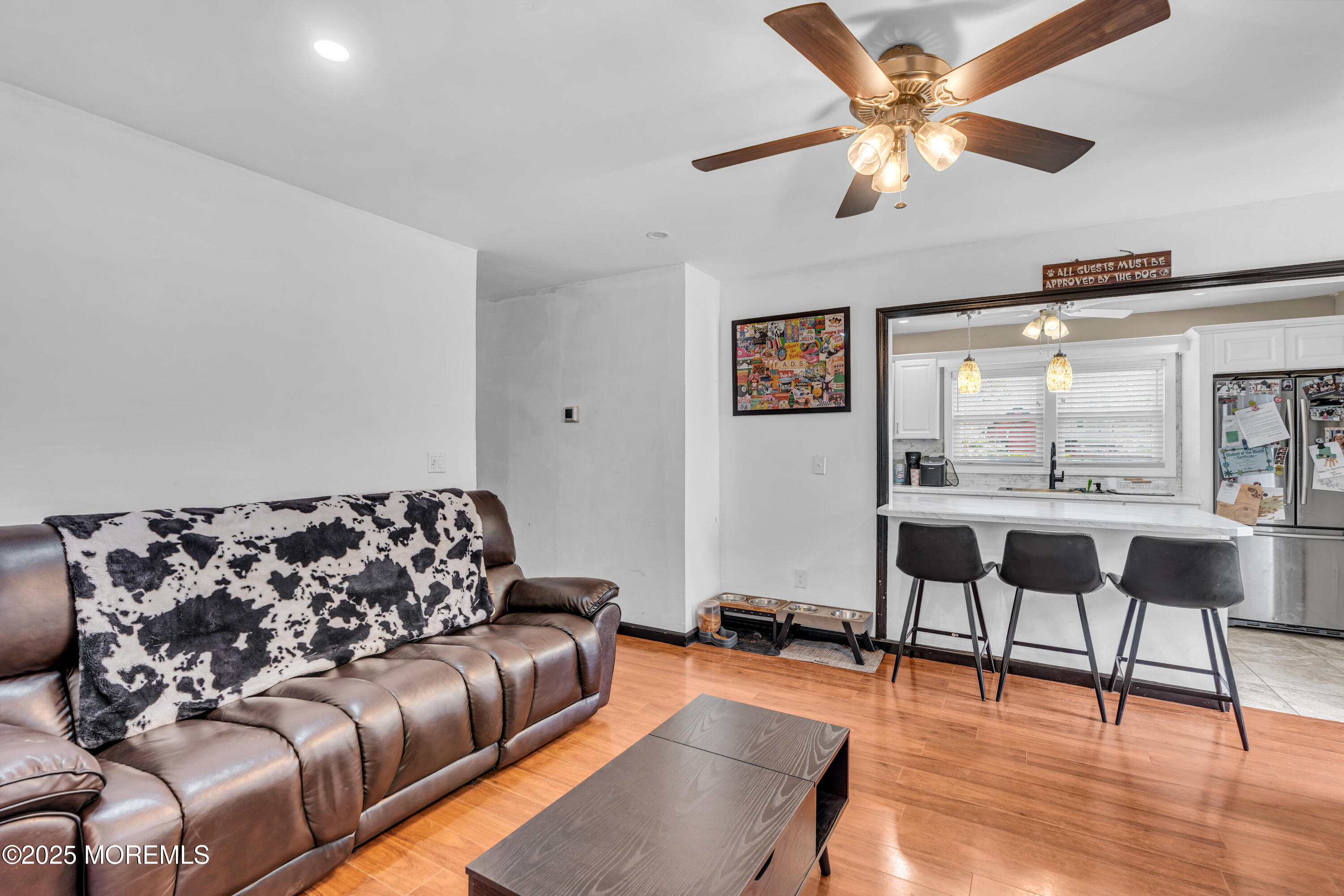 111 3rd Street Barnegat, NJ 08005 - Photo 3 of 22 a living room with furniture and wooden floor