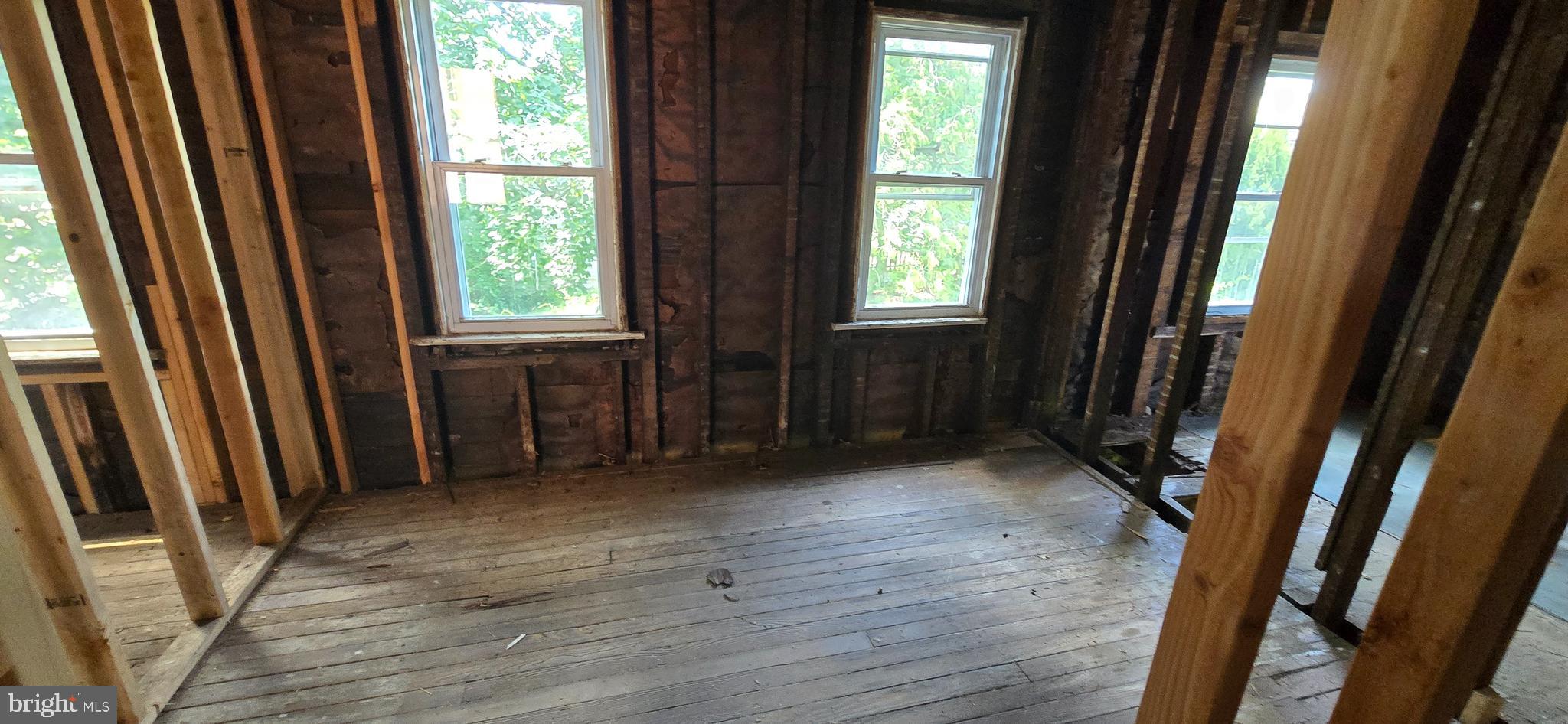 845 Bordentown Road Burlington, NJ 08016 - Photo 13 of 17 a view of an empty room with wooden floor and a window