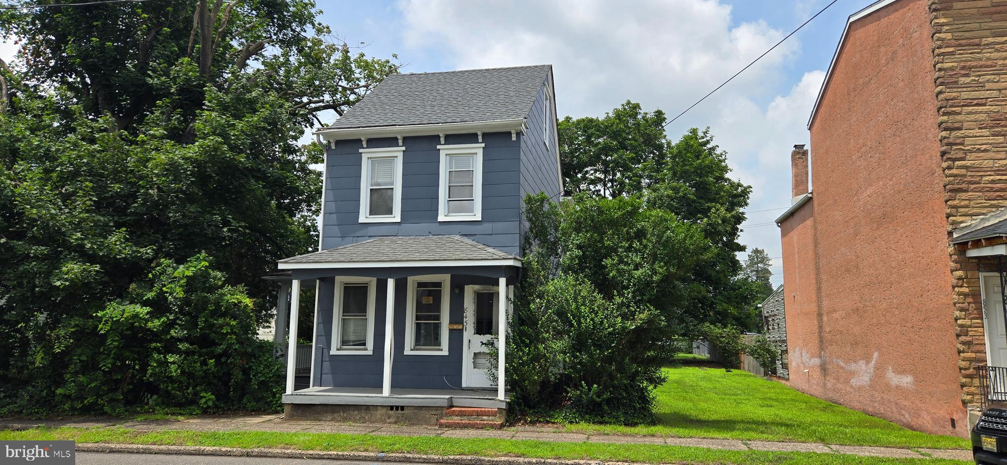 845 Bordentown Road Burlington, NJ 08016 - Photo 2 of 17 a front view of a house with a yard and trees