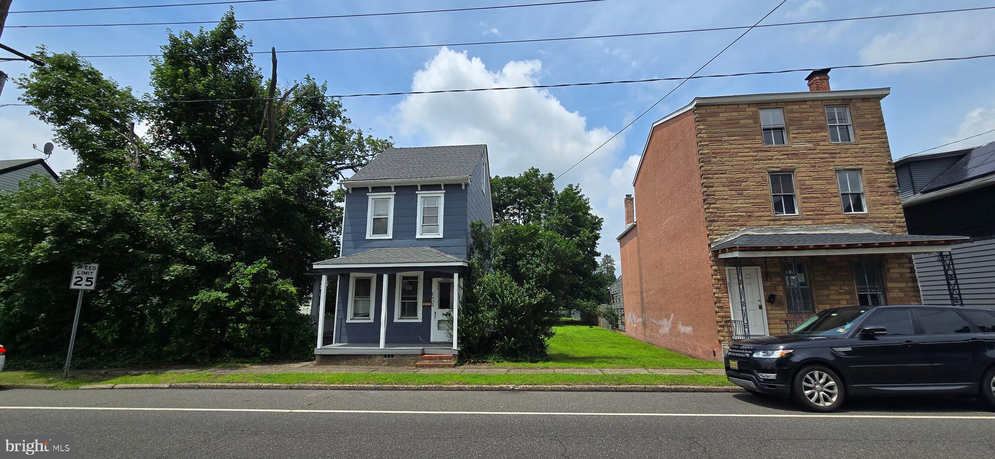 845 Bordentown Road Burlington, NJ 08016 - Photo 3 of 17 a front view of a house with a garden and parking