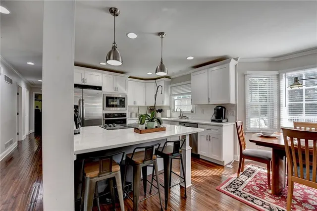 a view of a dining room with furniture and window