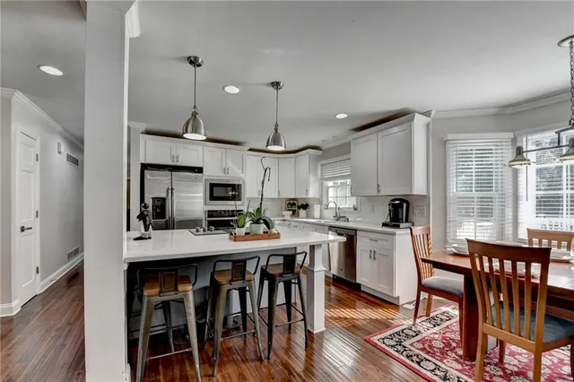 a view of a dining room with furniture window and wooden floor
