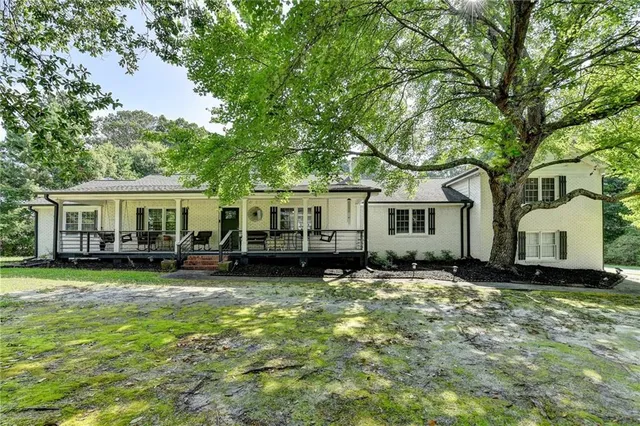 a view of a house with a back yard