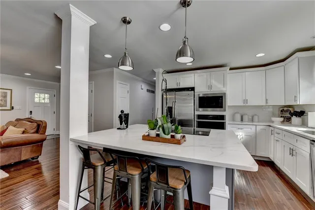 a bathroom with a sink double vanity and a mirror
