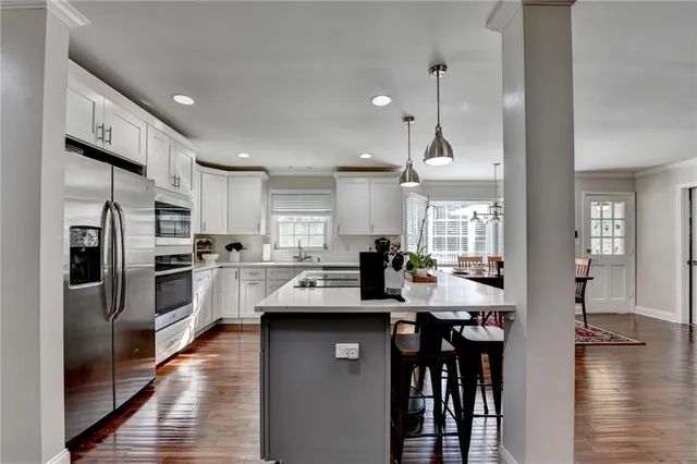 a bedroom with a bed and a chair