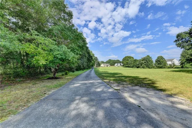 a living room filled with furniture and a wooden floor