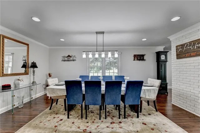 a living room with furniture ceiling fan and a window