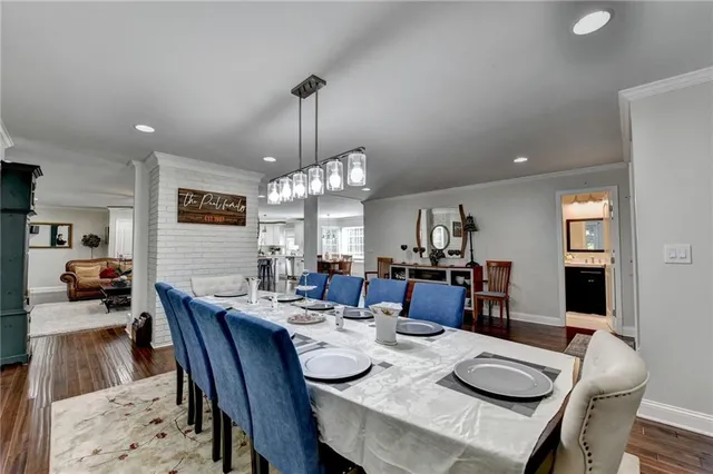 a spacious bathroom with a double vanity sink toilet mirror and bathtub
