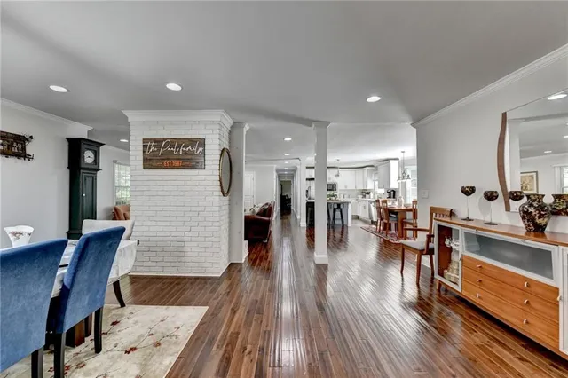 a bathroom with a tub a sink and a window