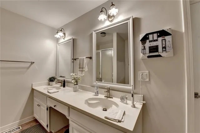 a view of a big yard with plants and large trees