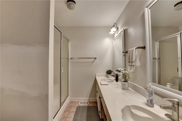 a view of a house with a big yard and large trees