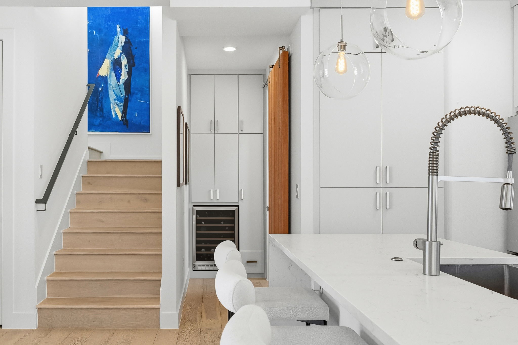 2508 Paramount Avenue, Unit B Austin, TX 78704 - Photo 11 of 40 Stunning custom contemporary cabinetry is stacked to the ceiling providing you with a true chef's storage capacity including excellent built-in pantry storage and a tucked away wine fridge.